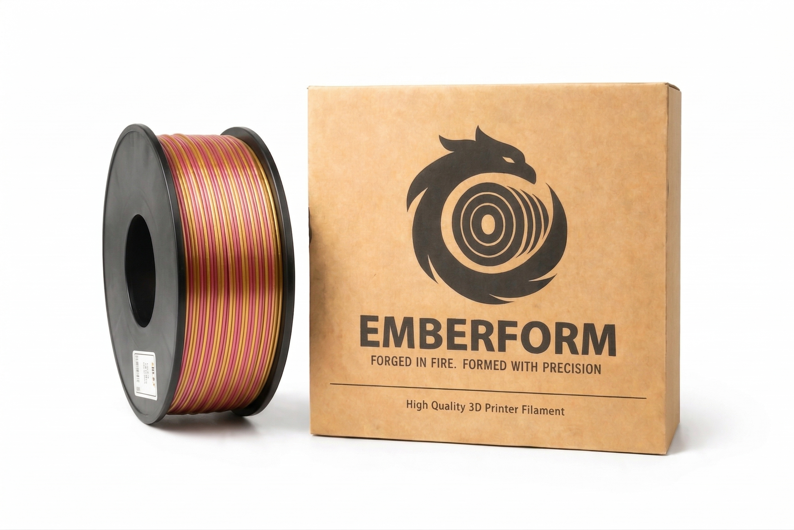 Spool of Silk gold and pink 3D printer filament next to Emberform packaging on a white background